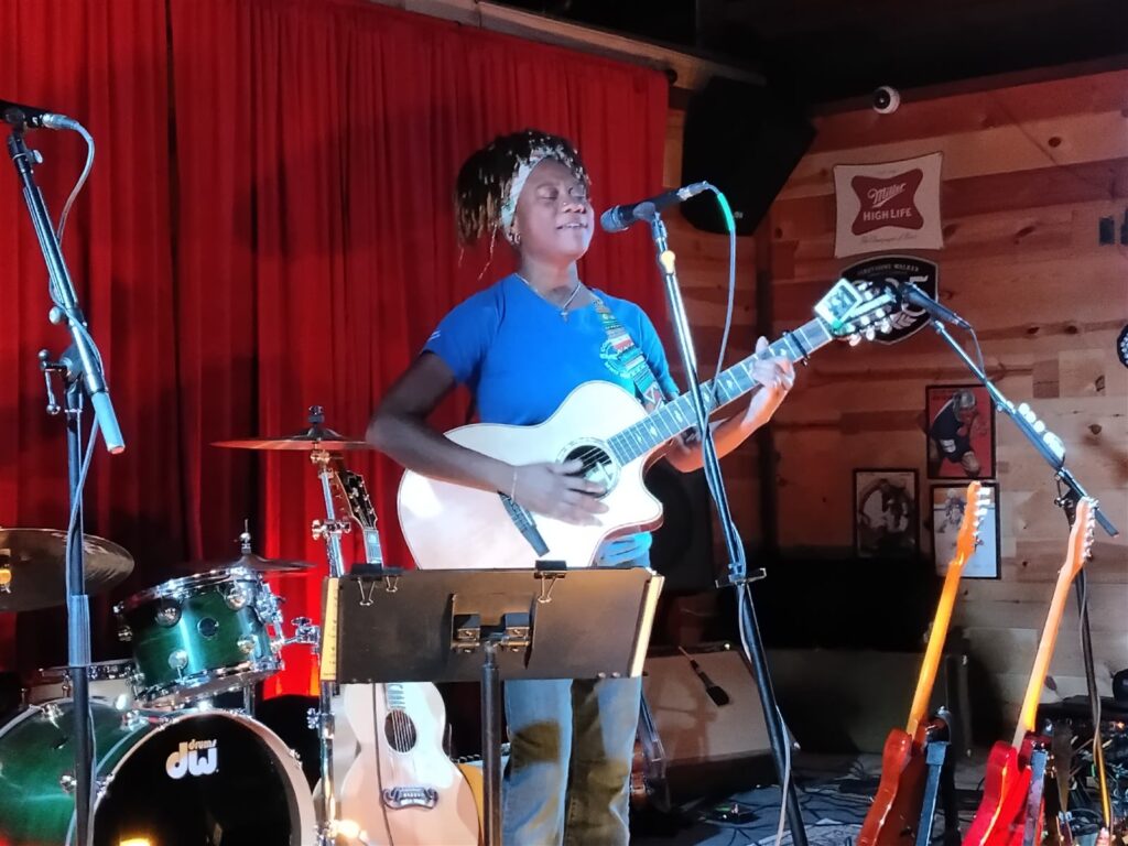 Singer and guitarist on The 156 stage